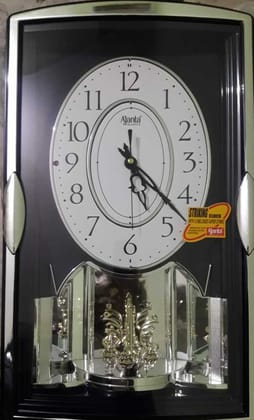 AJANTA Analog 45.7 cm X 28.2 cm Wall Clock  (Brown, With Glass, Musical)