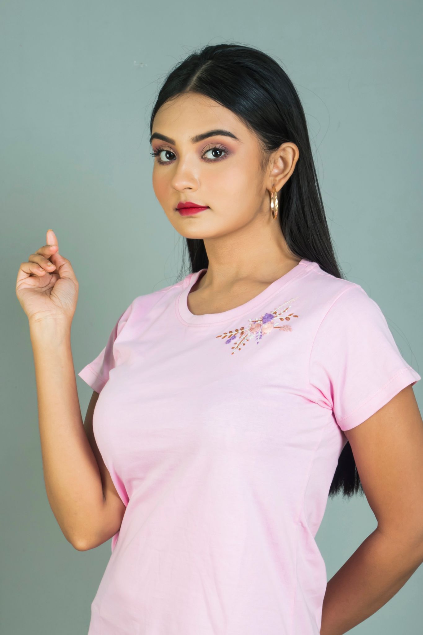 Pink coloured Hand embroidered women cotton T shirt with floral neck design.