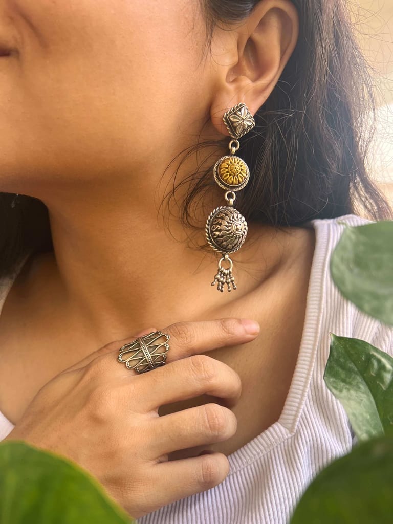 Stupa dual tone danglers in silver with carving