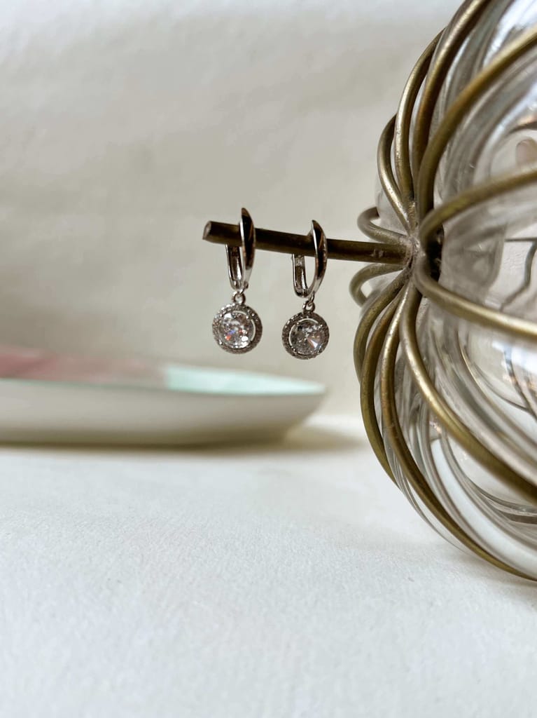 Aura mini danglers in silver with circle crystal charm
