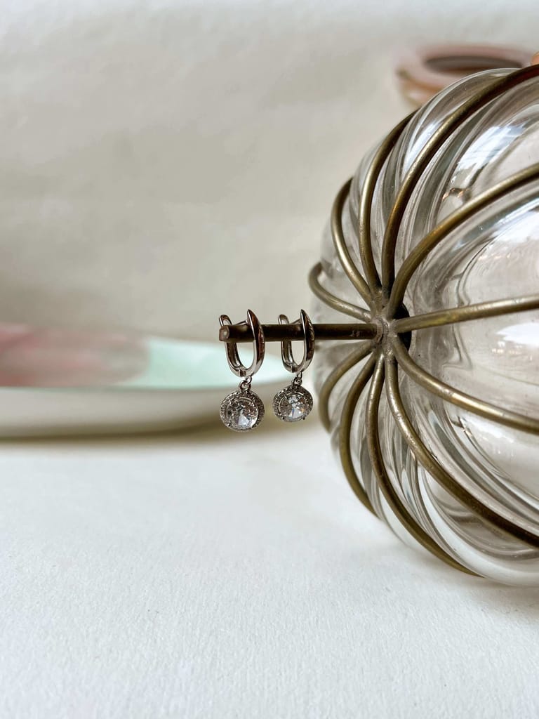 Aura mini danglers in silver with circle crystal charm