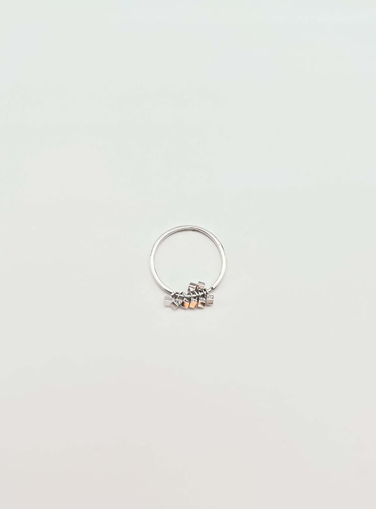 Elara sterling silver ring with hanging cube motif with zircon