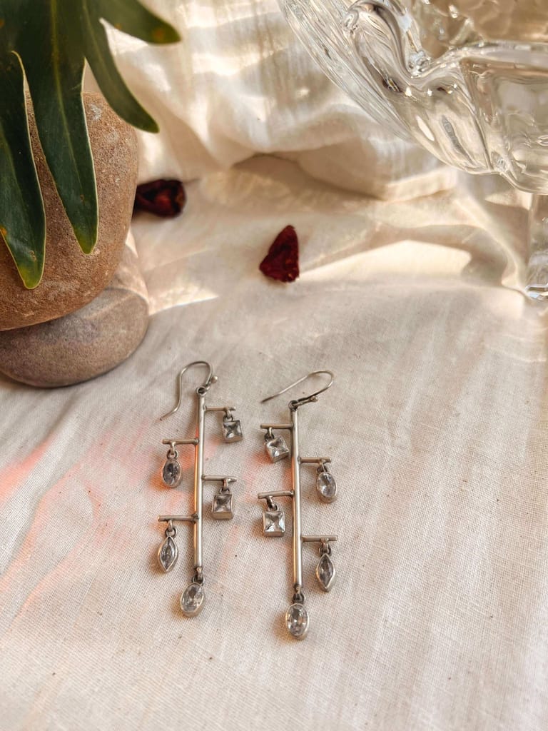 Shrinkhla danglers in silver with zircon charms