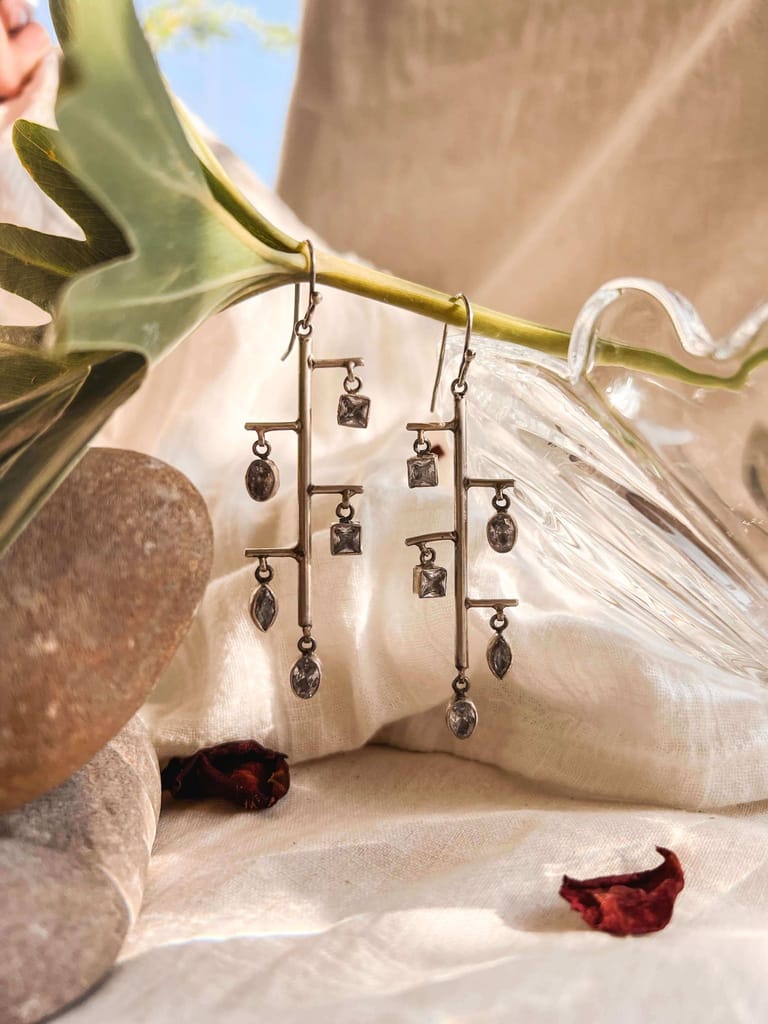 Shrinkhla danglers in silver with zircon charms