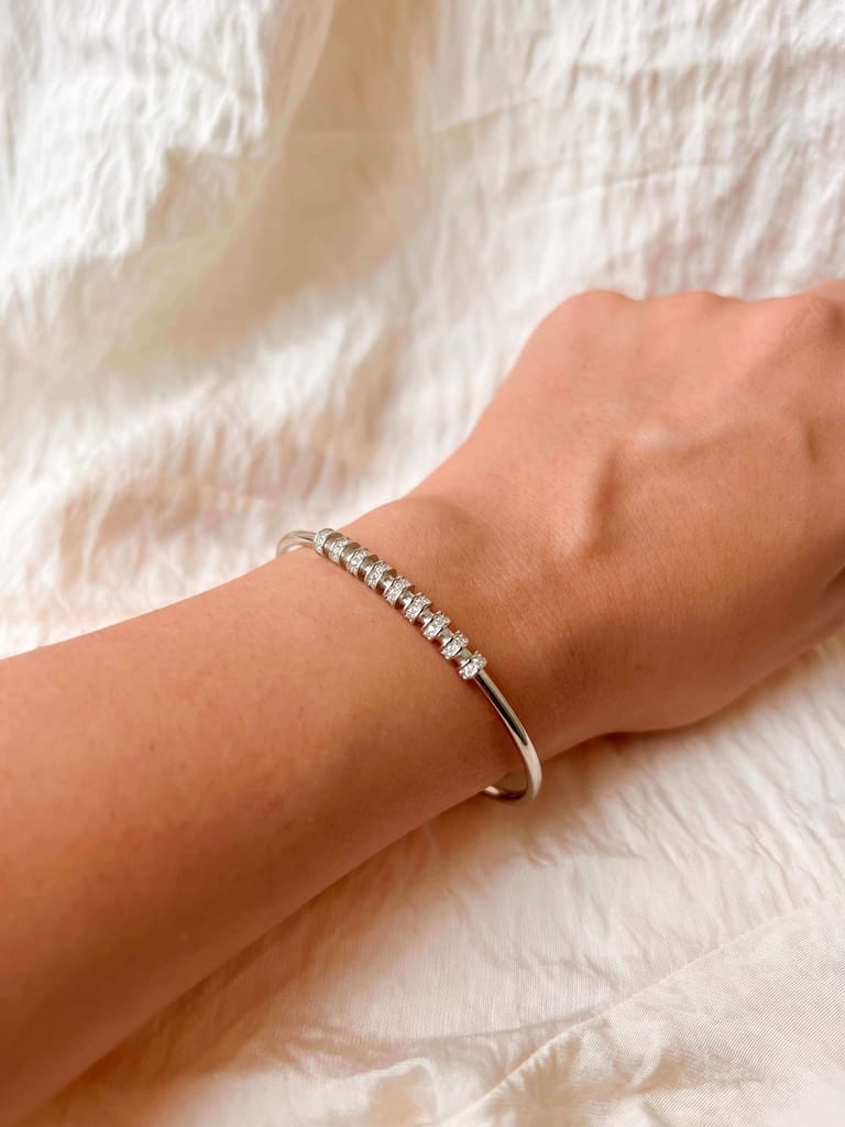 Twisty bracelet cuff in silver with zirconia