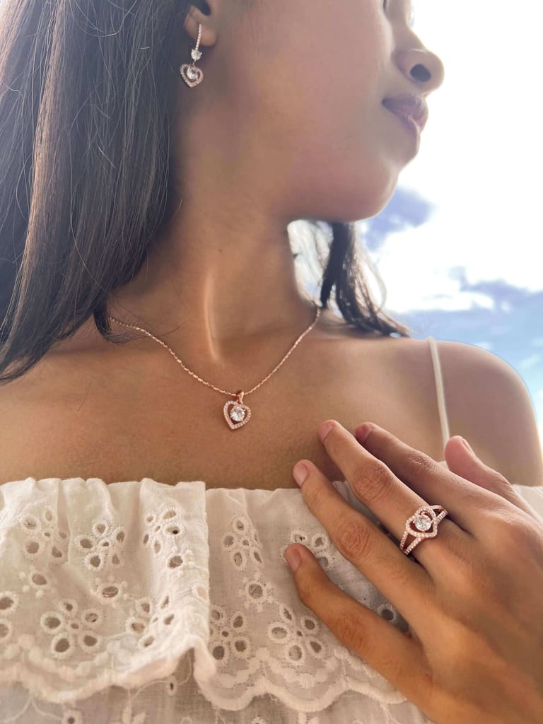 Mila silver necklace set in rose gold plating with round cut mossainite