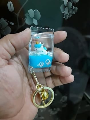 VSS fancy stylish Glass Toffee Candy filled with Liquid and Toy inside Keyring Keychain for girls and women (Blue)
