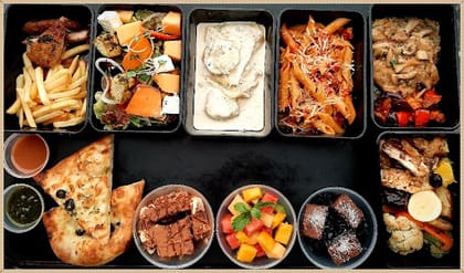 Feast In A Box With Italian Grills - NON VEG (Serves 2-3) __ Chicken Scaloppini With Mushroom Sauce & Buttered Veggies,Peppered Chicken Steak With Rosemary Potatoes,Greek Salad,Tiramisu,Chocolate Mousse,Fresh Fruits