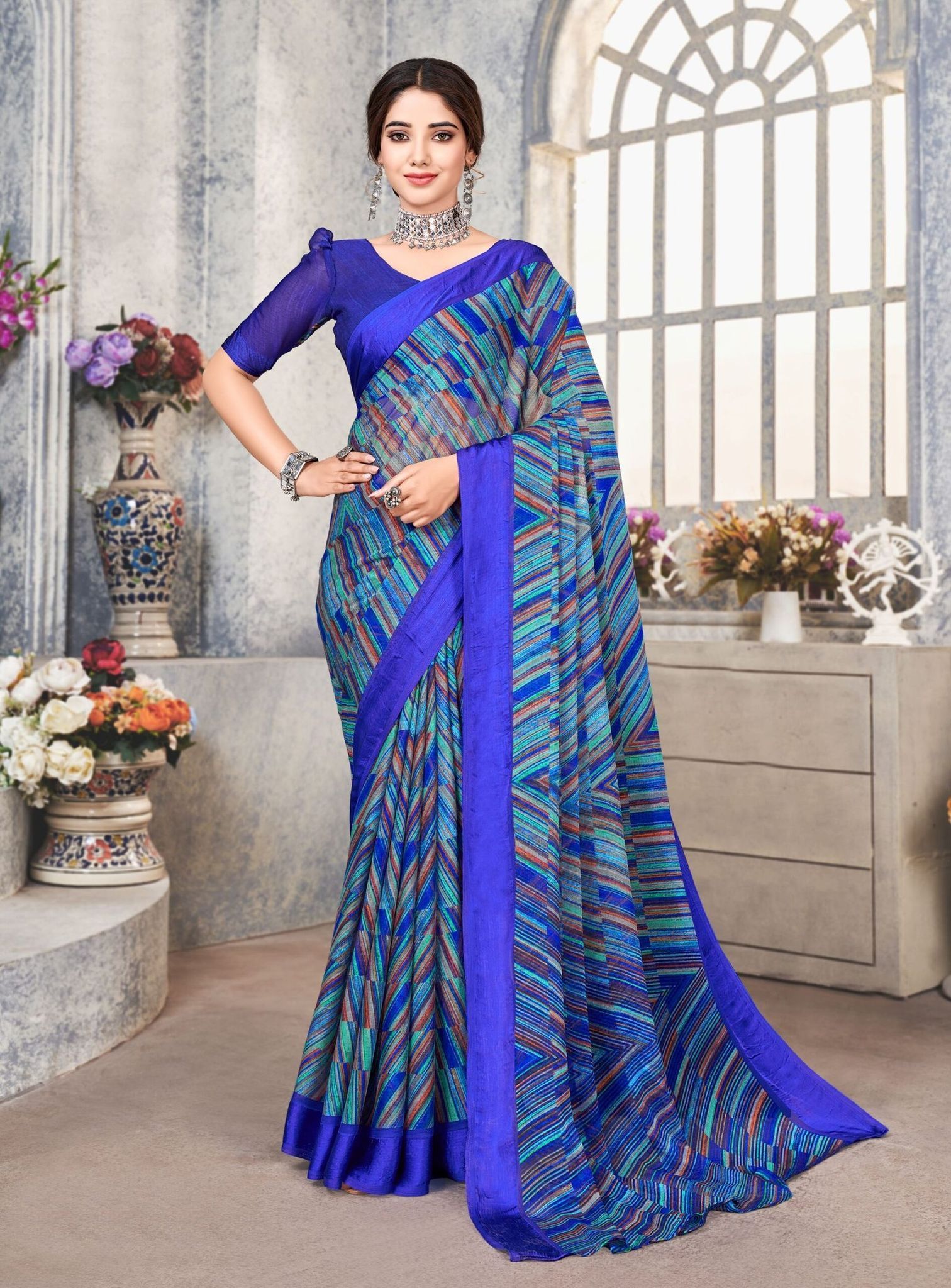 Multicolor Chiffon Printed Saree with Fancy Border And Blue Fancy Printed Blouse Material.