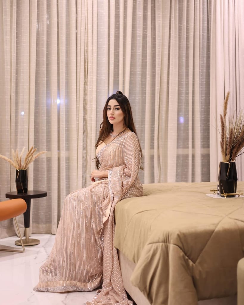 Women's Peach Georgette Embellished Saree with Unstitched Blouse