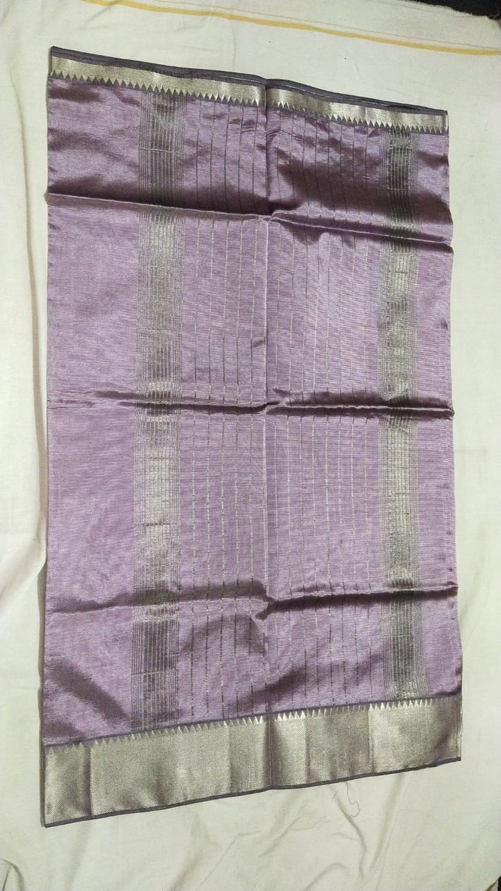 KANCHI BORDER SAREE A beautiful, handwoven matka silk saree in a soft Fly Ash shade. This elegant saree features a zari border and pallu, and is perfect for any special occasion.