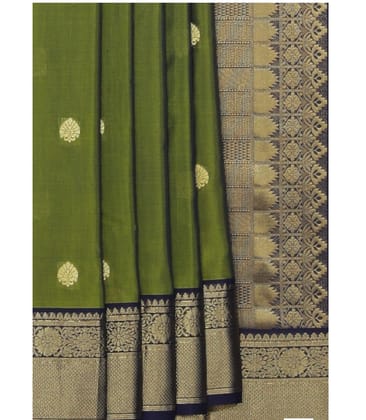 Green and gold zari woven Kanchipuram silk saree with blouse piece Green and gold zari woven Kanchipuram silk saree with blouse piece