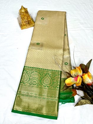 Golden color with Green accents and gold zari woven Kanjivaram silk saree Golden color with Green accents and gold zari woven Kanjivaram silk saree