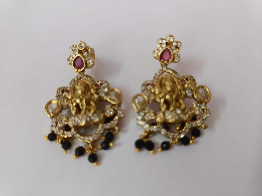 Trendy Women "Stunning antique gold plated Goddess Lakshmi earrings with intricate detailing and