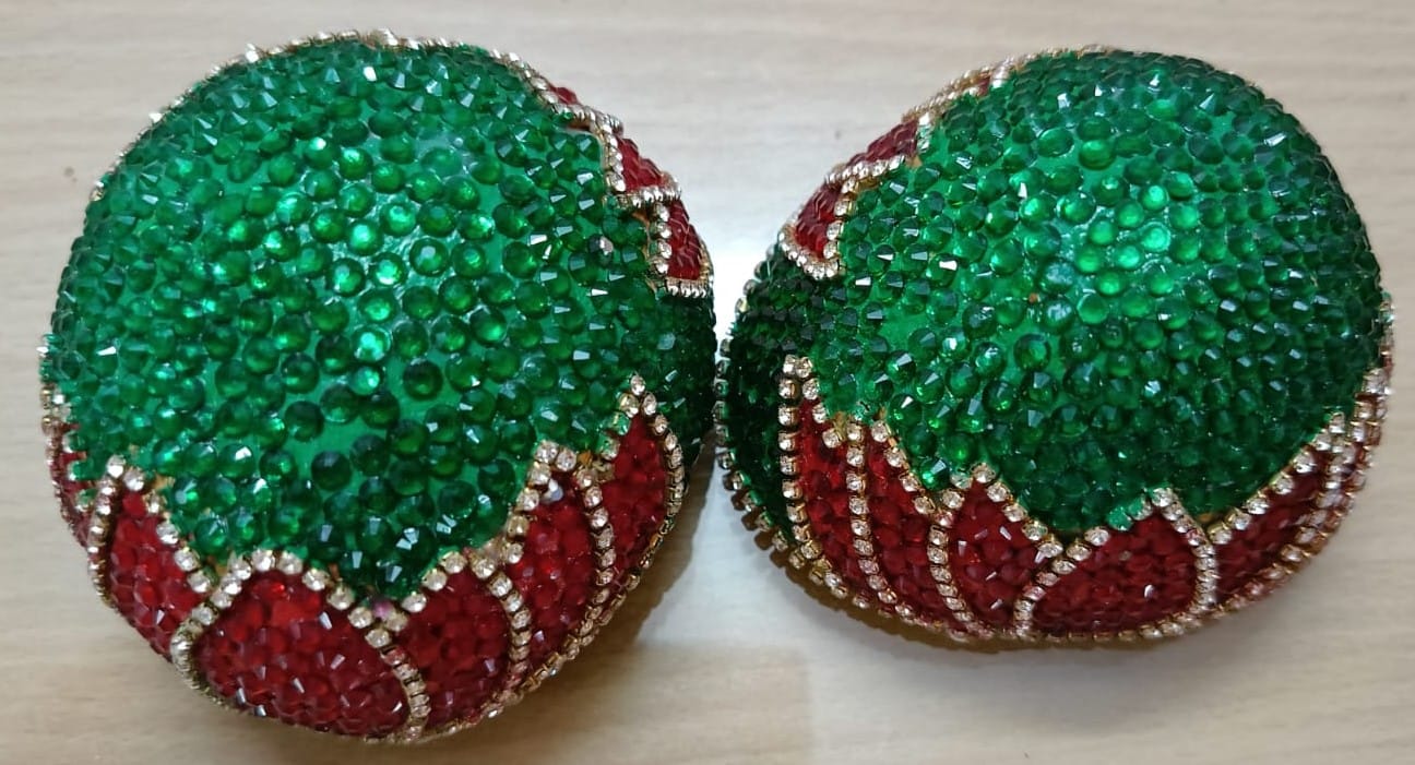 GREEN AND RED RHINESTONE STUDDED COCONUT SHELL BALLS