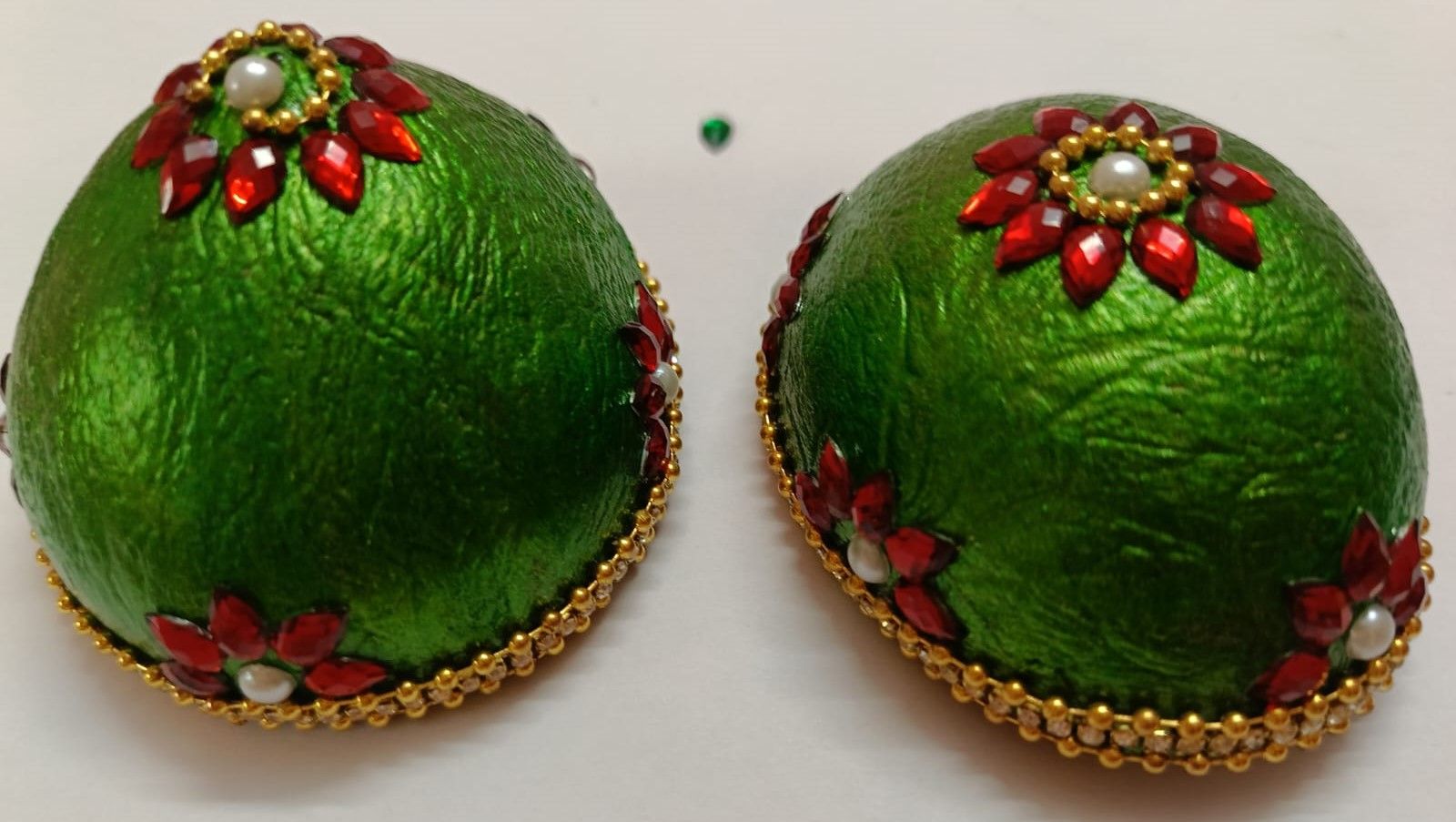 GREEN AND RED RHINESTONE STUDDED COCONUT SHELL BALLS