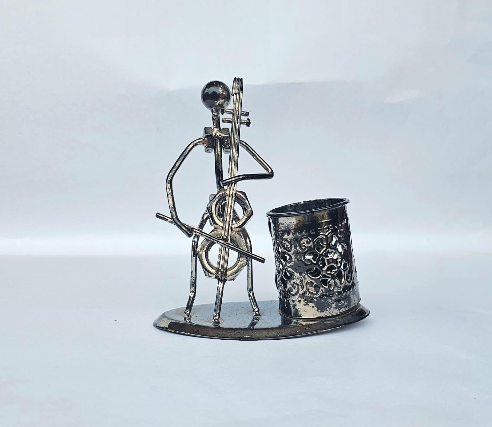  Metal sculpture of a man playing the cello