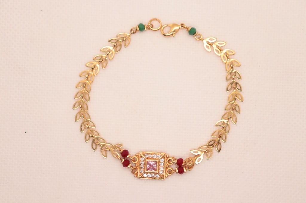 Bracelet with Center Square Pink Stone Surrounded by Clear Stones and Red Stones