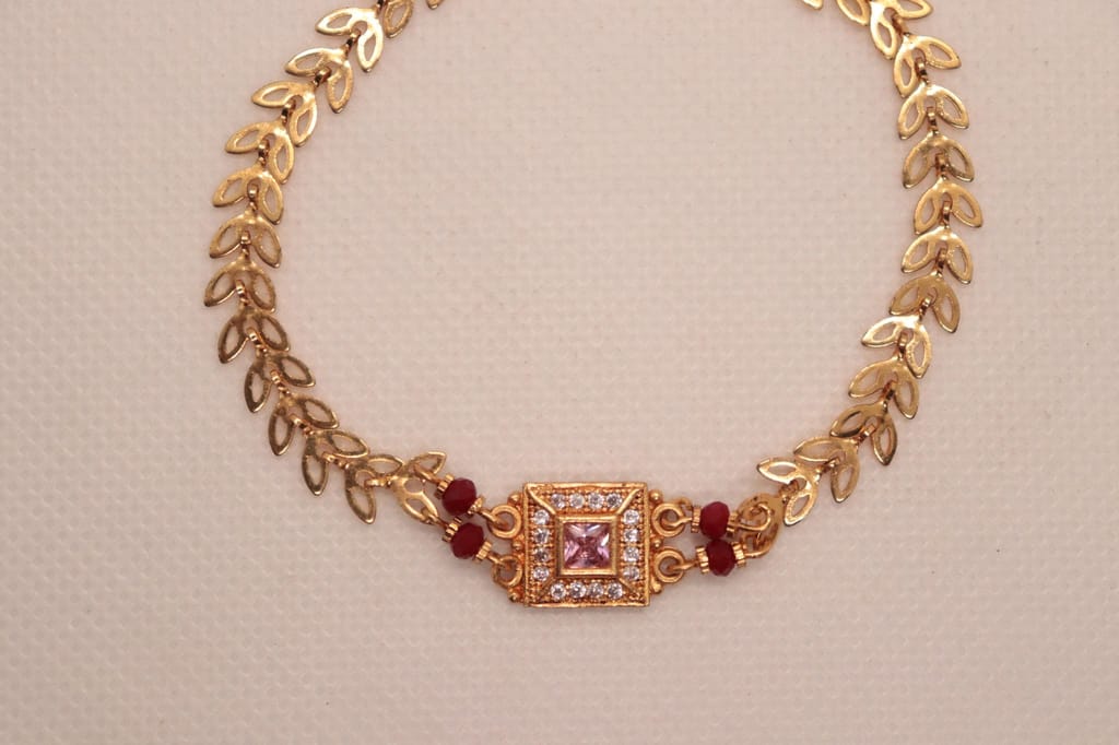 Bracelet with Center Square Pink Stone Surrounded by Clear Stones and Red Stones