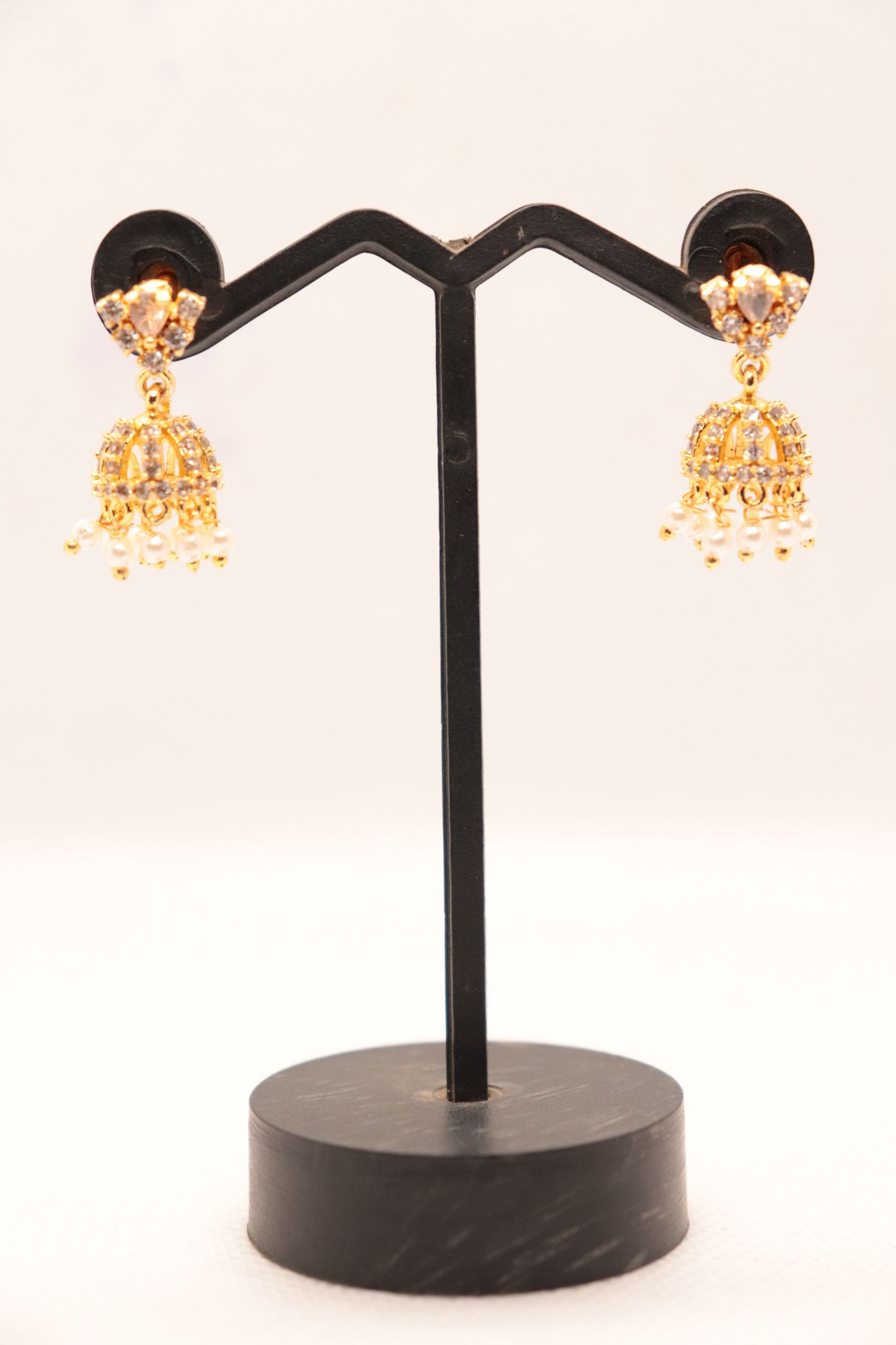 Gold plated pearl and cubic zirconia jhumka earrings