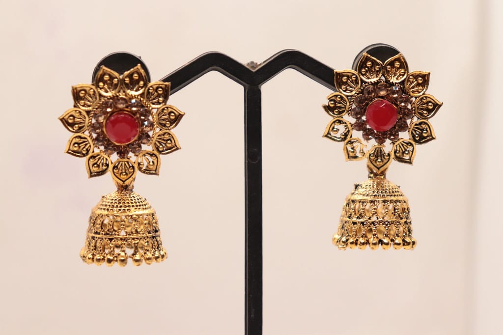 "Stunning Red Stone Jhumka Earrings with Intricate Gold Design"
