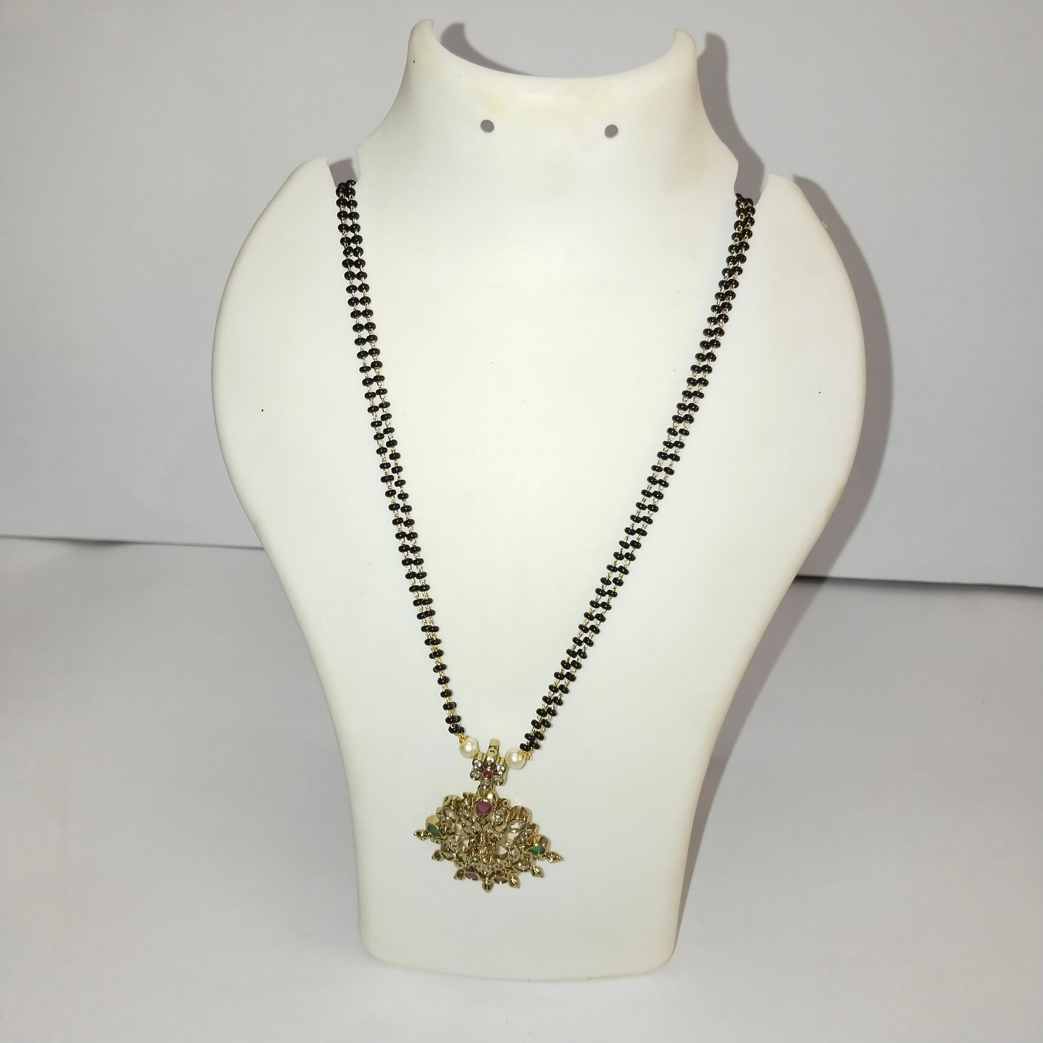 Black Beads Mangalsutra with intricate gold pendant