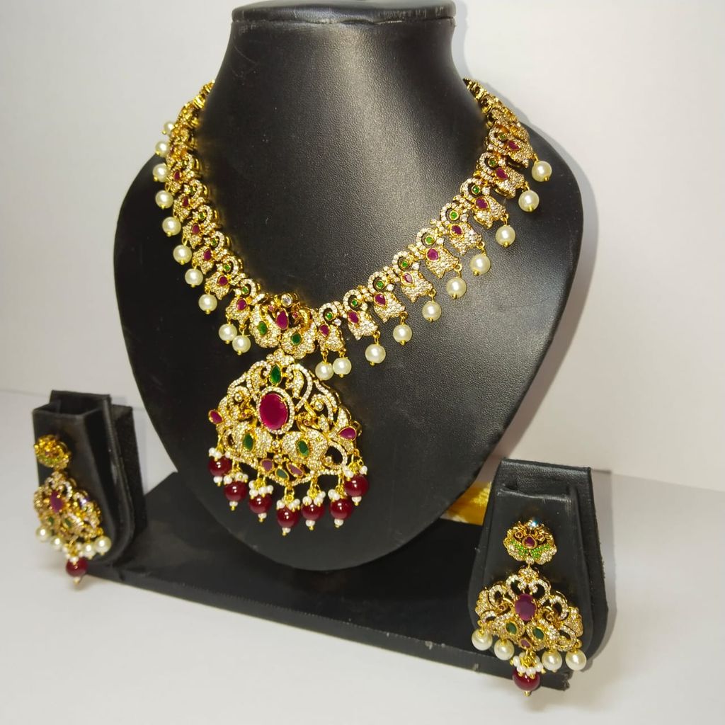 Traditional Indian necklace set with intricate detailing and pearl drops