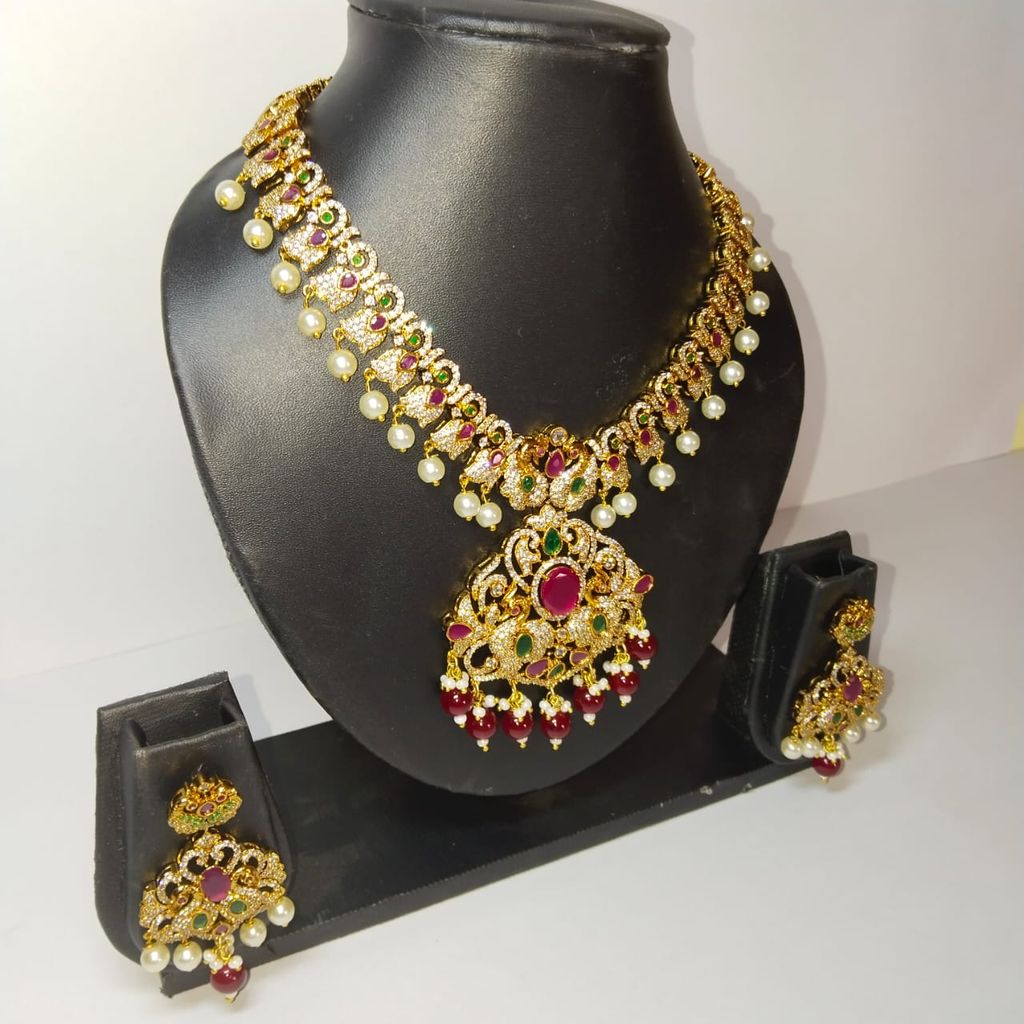 Traditional Indian necklace set with intricate detailing and pearl drops