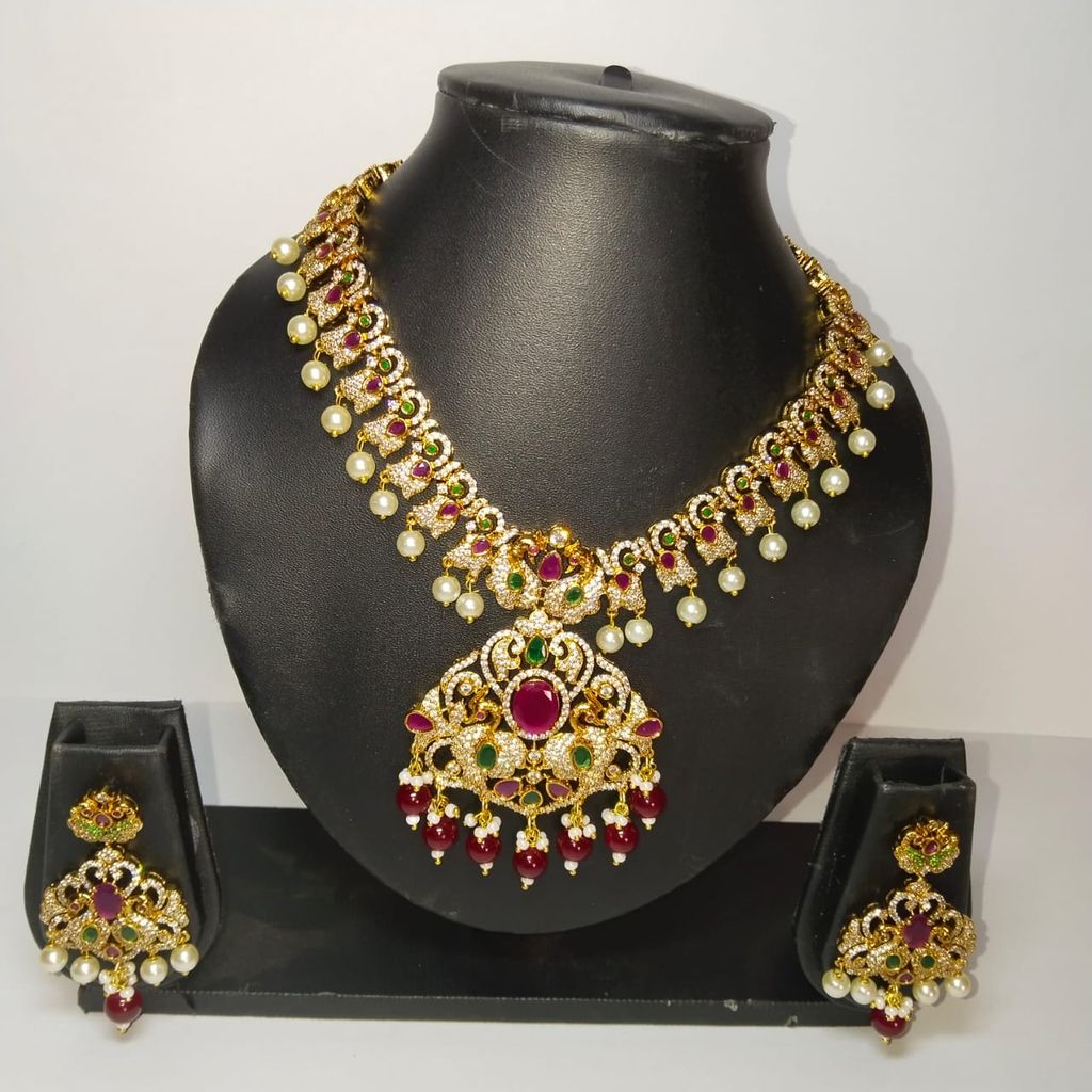 Traditional Indian necklace set with intricate detailing and pearl drops