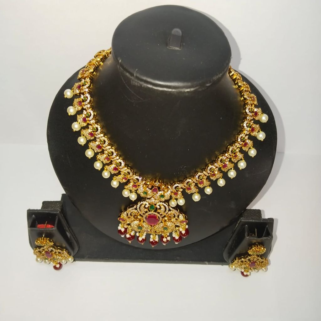 Traditional Indian necklace set with intricate detailing and pearl drops