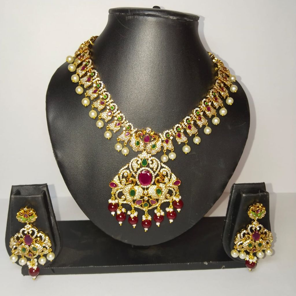 Traditional Indian necklace set with intricate detailing and pearl drops