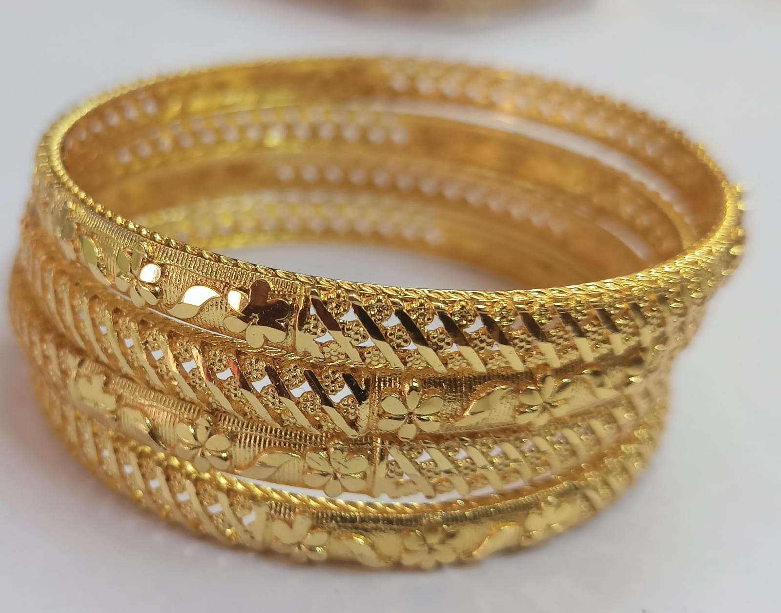 22K Yellow Gold Bangles with Intricate Floral Design - Set of 4