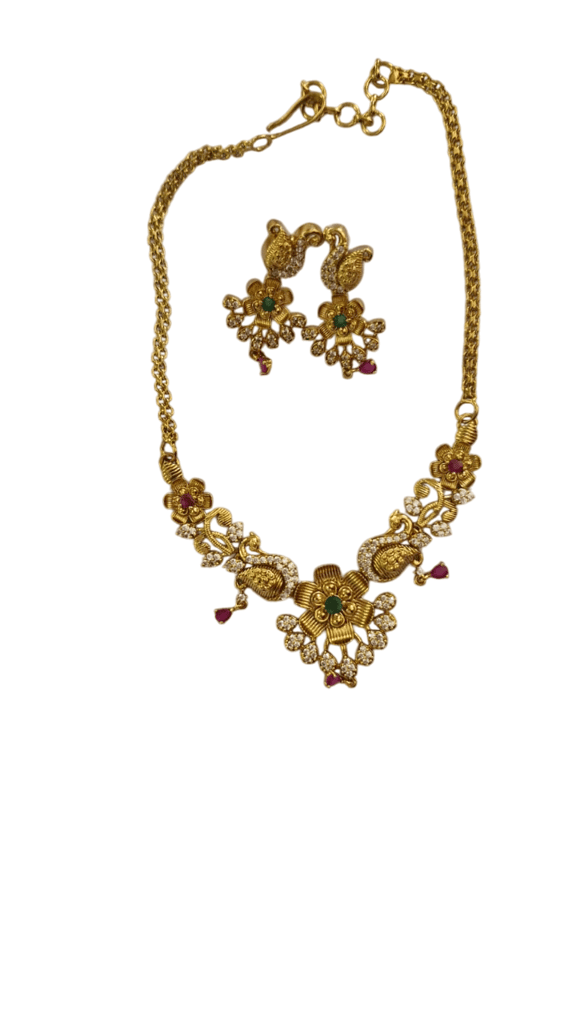Gold-plated traditional Indian necklace set with intricate floral design and ruby and emerald stones - Jewellery Sets | Buy online on ZillyBuy