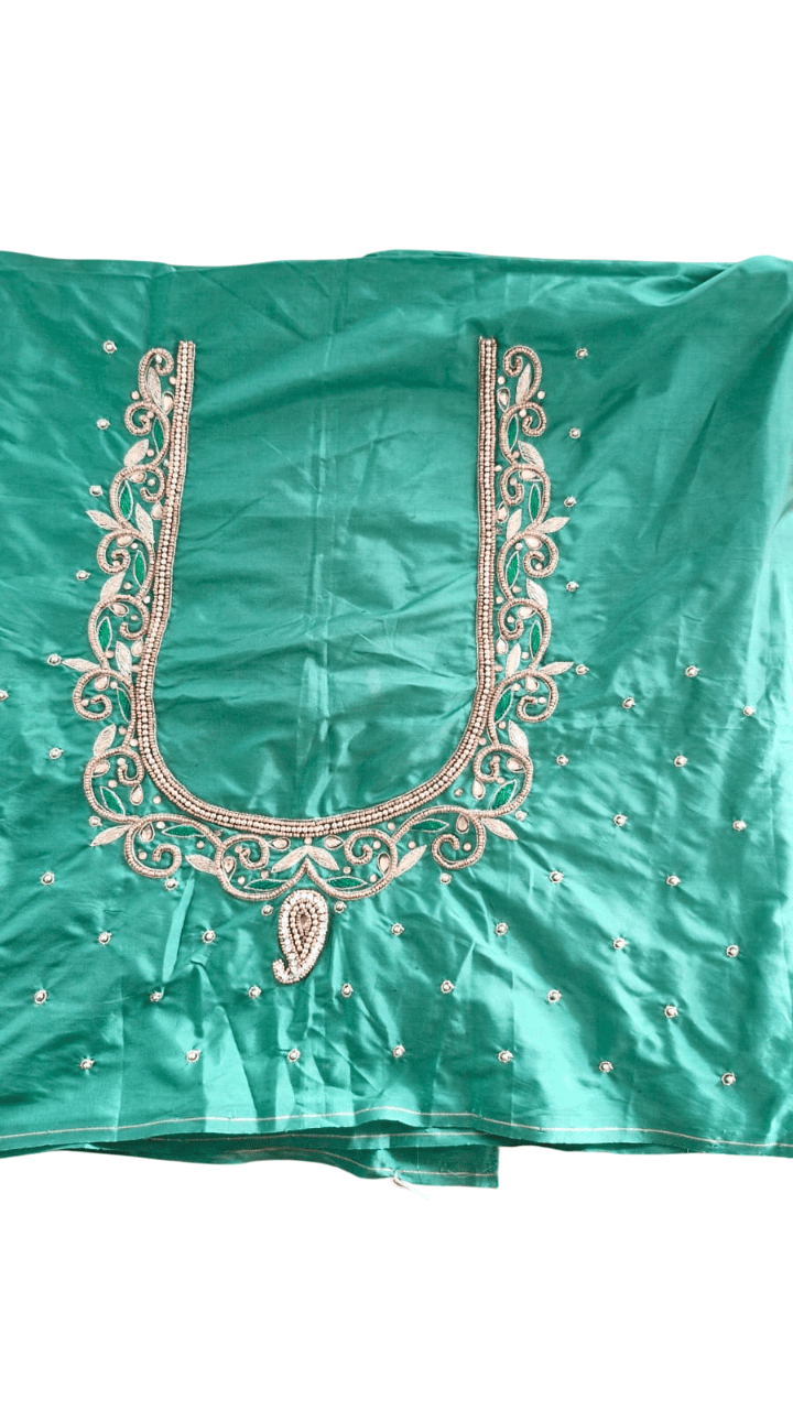 Green blouse with intricate zari and stone embroidery work