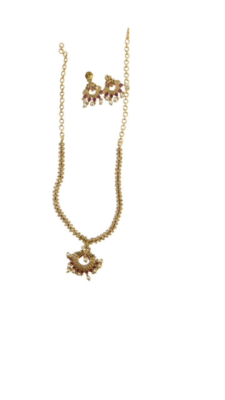 Gold-plated traditional Indian necklace set with intricate detailing and pearl drops, perfect for special occasions