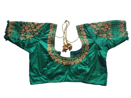 Green blouse with intricate zari embroidery and mirror work