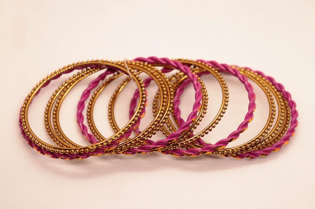 "Exquisite Fuchsia and Gold Bangle Set - Perfect for Traditional Indian Attire"