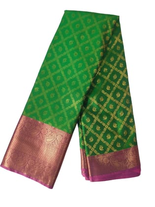 Green and gold zari woven Kanchipuram silk saree with contrast pink border