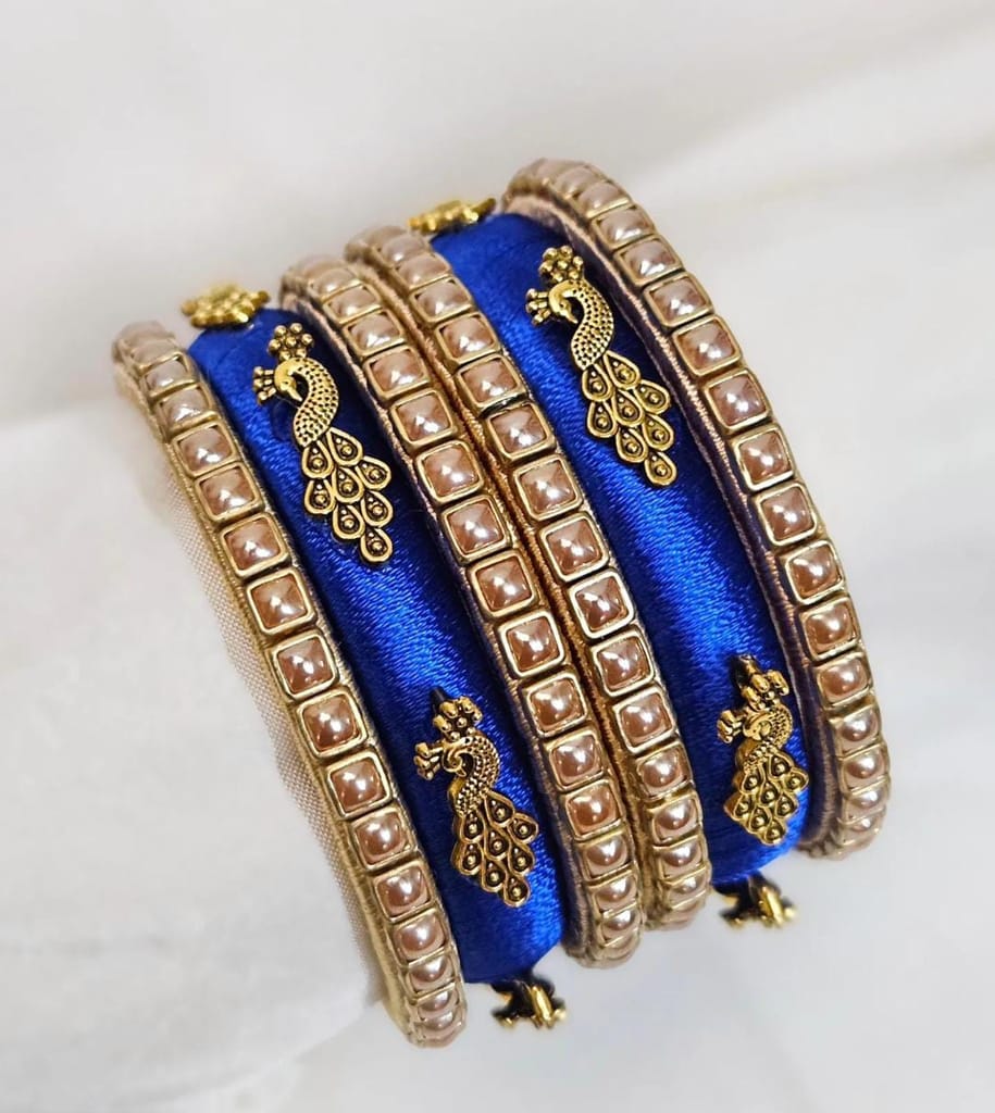 Set of 6 Blue Silk Thread Bangles with Golden Peacock Design and Pearl Beads