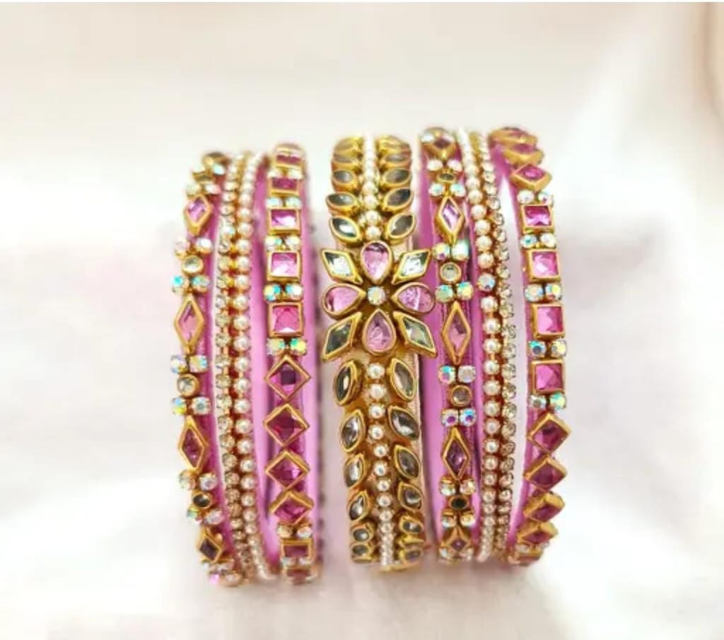 An exquisite set of 8 bangles,