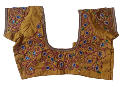 Golden color maggam work blouse with intricate embroidery and mirror work
