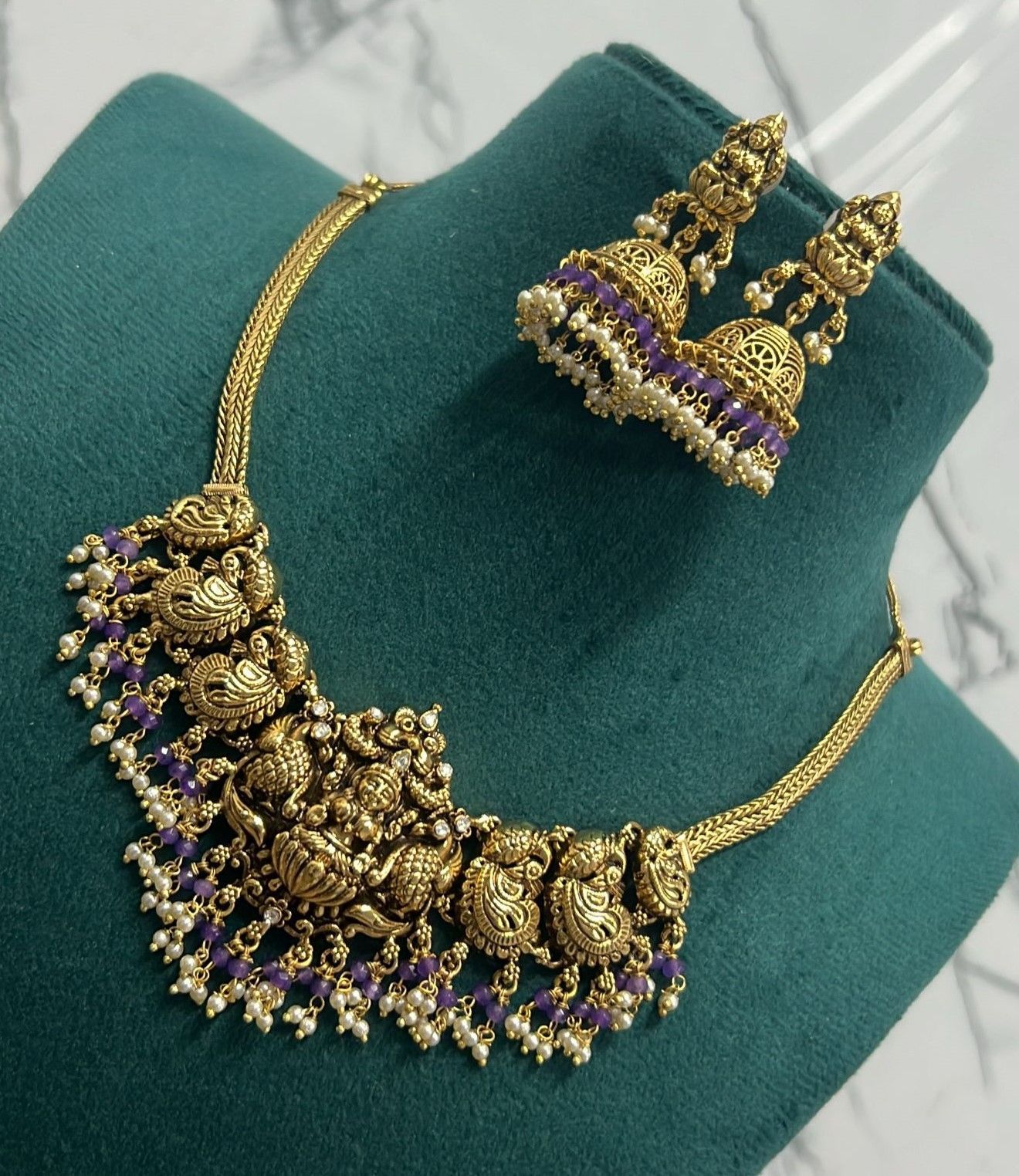 Gold-plated antique finish necklace set with purple stones and pearls