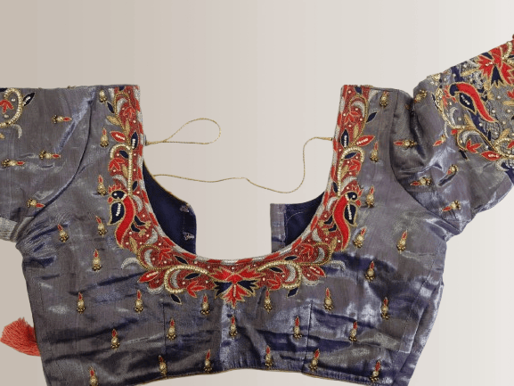 Aari work blouse with intricate peacock embroidery