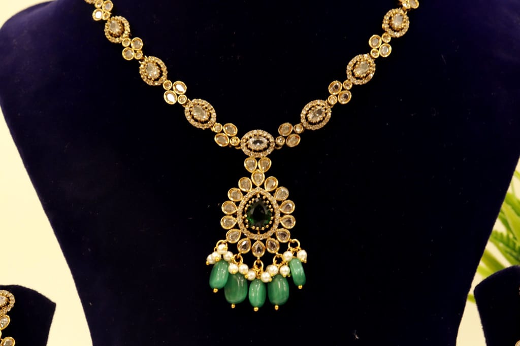 Gold-plated Kundan and Pearl Choker Necklace Set with Green Stones