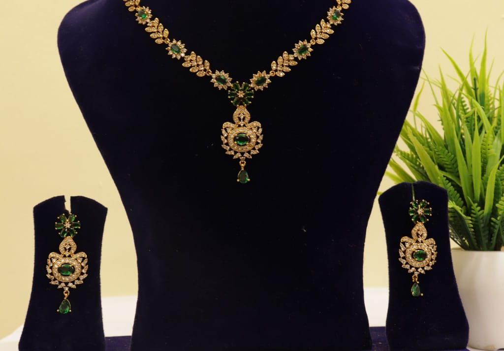 Gold-plated Kundan and Pearl Necklace Set with Green Stones