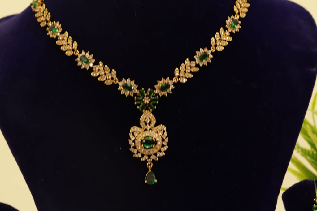 Gold-plated Kundan and Pearl Necklace Set with Green Stones