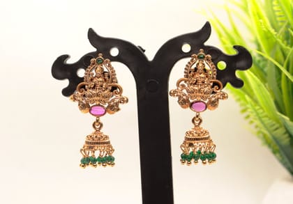 Gold Plated Goddess Lakshmi Antique Jhumka Earrings With Green Stones