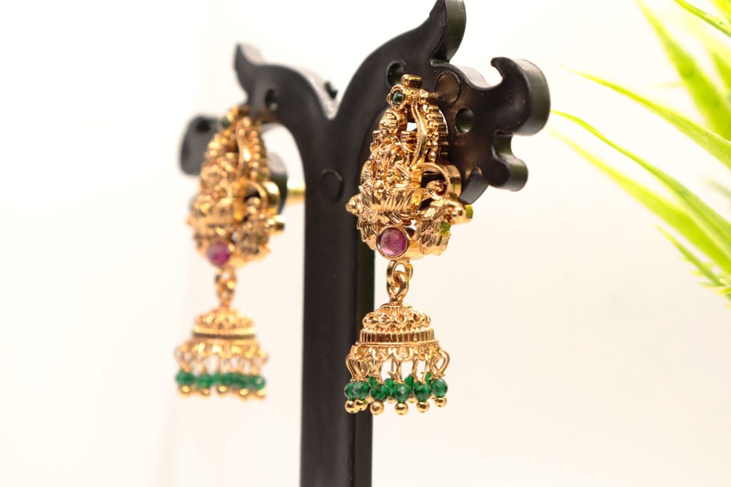Gold Plated Goddess Lakshmi Antique Jhumka Earrings With Green Stones