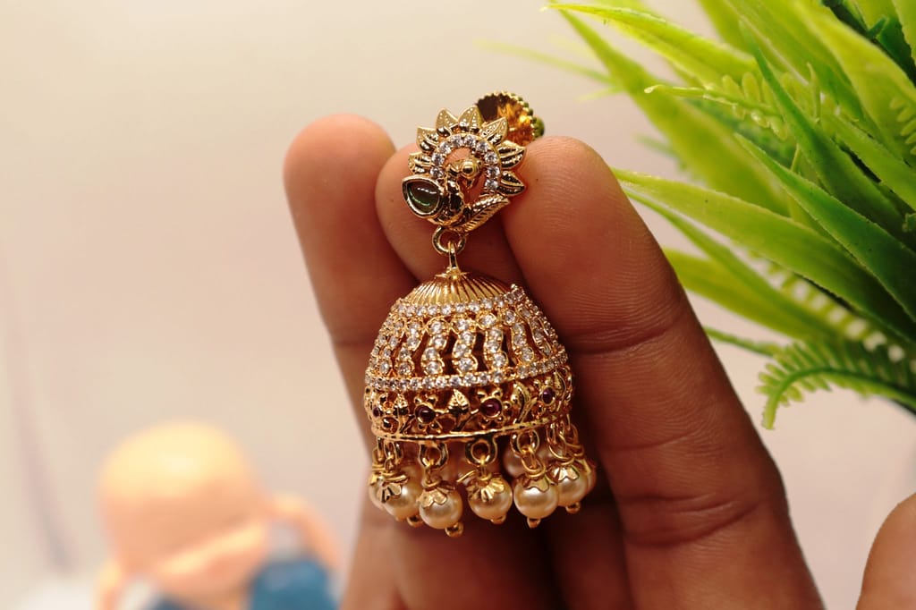 Stunning Pearl and Cubic Zirconia Jhumka Earrings in Gold Plated Alloy