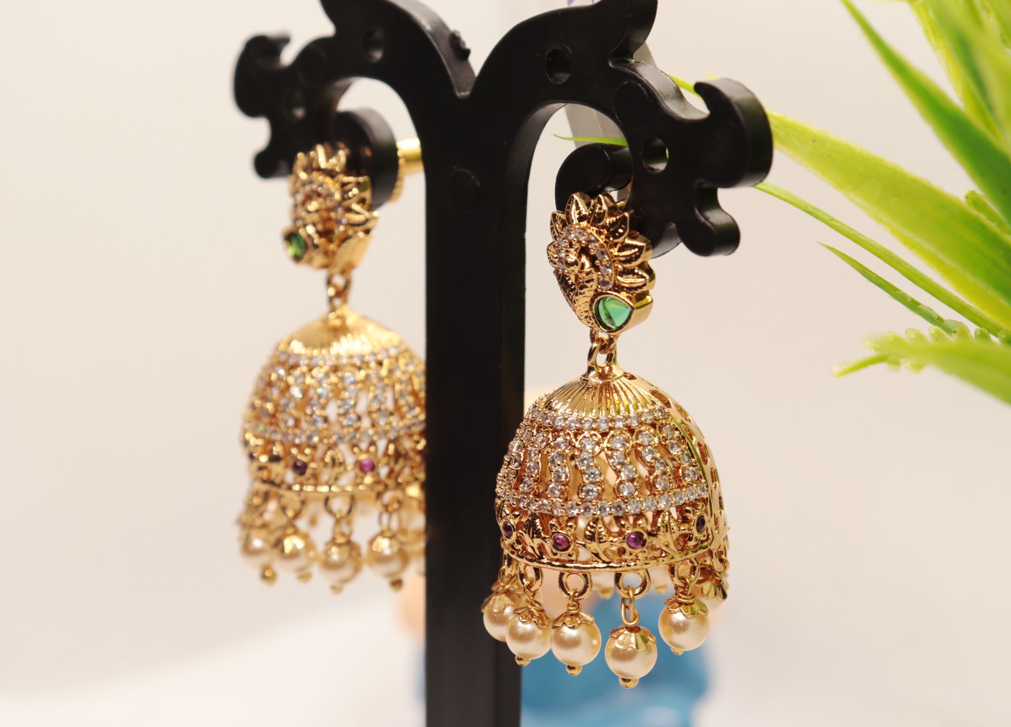 Stunning Pearl and Cubic Zirconia Jhumka Earrings in Gold Plated Alloy
